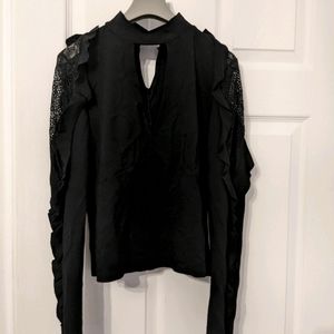 Black ace and ruffle long sleeve top